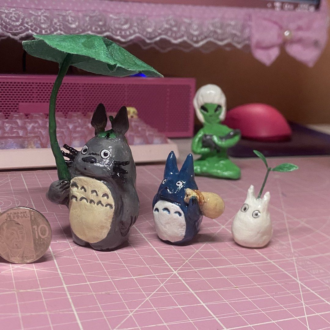 Studio Ghibli Totoro Clay Figurines Set (Category: Figurines & Statues) located in Dasmarinas. Submitted by chunli_ (Listing ID 1464238526, Image 2). Description: Detailed, hand-sculpted My Neighbor Totoro mini figure trio. Features Big Totoro with a leaf umbrella, Medium Blue Totoro with a sack, and Little White Totoro with a sprout. Perfect desk buddies or display pieces for anime fans! Quantity: 3 mini figures included Size: Micro-sized (see ₱