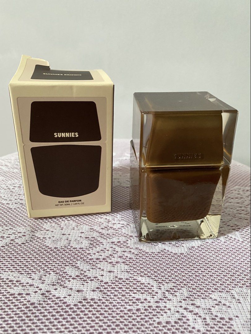 SUNNIES BROWN Eau de Parfum 50ml (Category: Fragrance & Deodorants) located in Mandaluyong City. Submitted by tootimetootimetootimee (Listing ID 1464206030, Image 1). Description: - Few sprays missing - Includes original box RFS: Declutterring MOP: Gcash, Metrobank, Unionbank MOD: Grab, Lalamove, J&T (sf c/o buyer).
