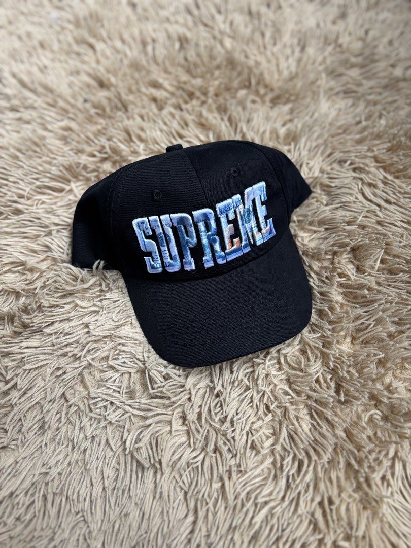 Supreme Cap - Black with Dollar Bill Logo (Category: Caps & Hats) located in Quezon City. Submitted by nojthrift (Listing ID 1464252905, Image 1). Description: - Authentic Black Supreme Cap - Features iconic Supreme logo with dollar bill design - Made in USA - Adjustable strap for a custom fit - Ideal for everyday wear - A classic streetwear essential.