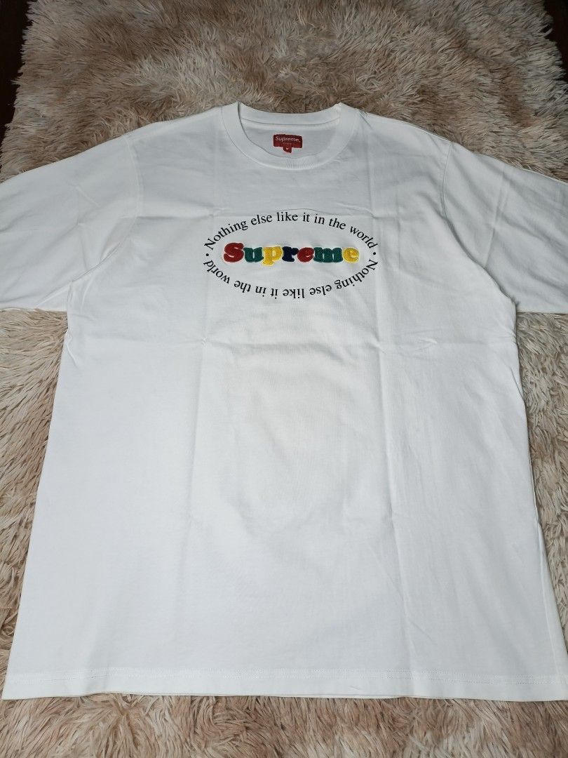 Supreme T-shirt White Size M "Nothing else like it" (Category: Tshirts & Polo Shirts ) located in Manila. Submitted by mamijessa (Listing ID 1464249812, Image 2). Description: - Authentic Supreme T-shirt 100% - Size: Medium (M) - Unique graphic: "Nothing else like it in the world" with colorful embroidered text - Material: 100% Cotton - Ideal for everyday casual wear - Good as new - 10/10 Condition.