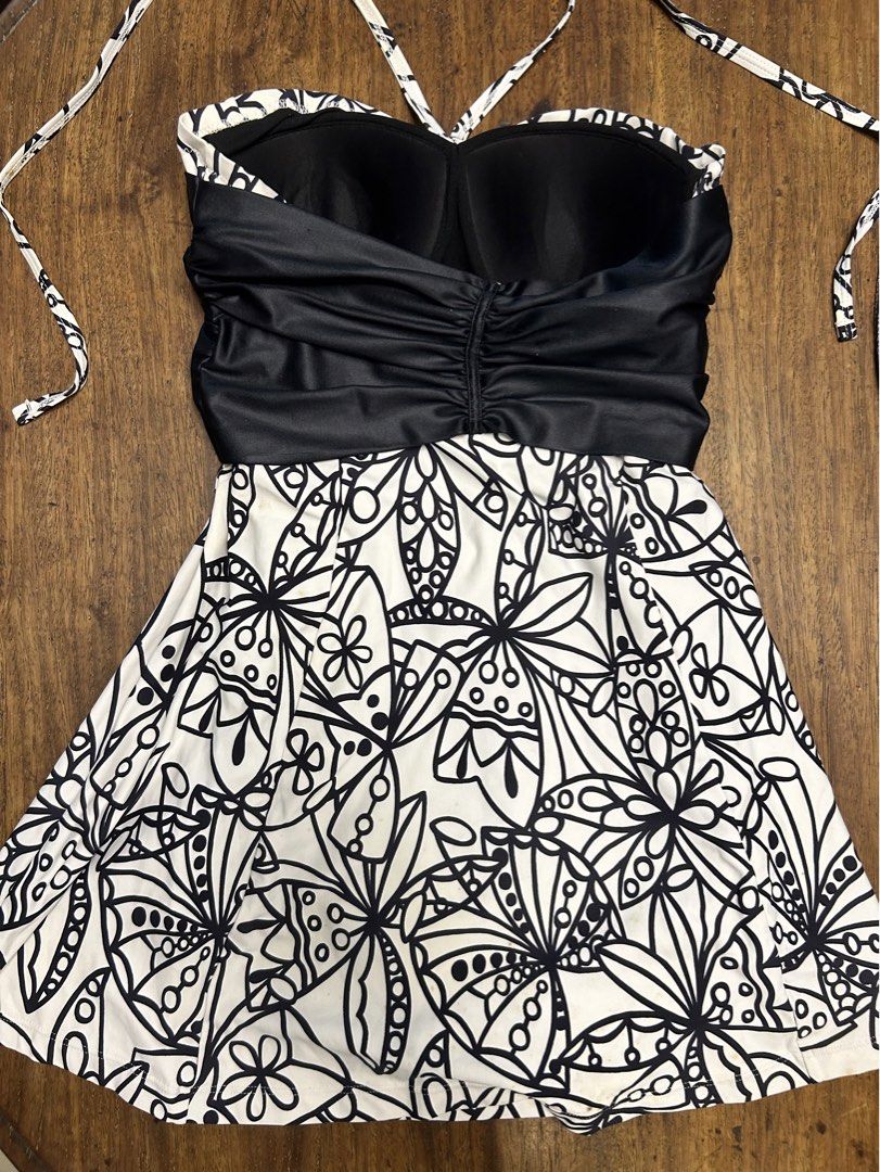 Black & White One-Piece Swimsuit (Category: Bikinis & Swimsuits) located in Manila. Submitted by tshopph (Listing ID 1464218003, Image 2). Description: Black & White One-Piece Swimsuit 🖤🤍 Stylish black and white floral one-piece swimsuit with a flattering fit-and-flare silhouette. Features a ruched black bodice, sweetheart neckline, halter tie straps, and a bold floral print skirt. Cute and feminine while still offering good coverage. ✨ Halter 