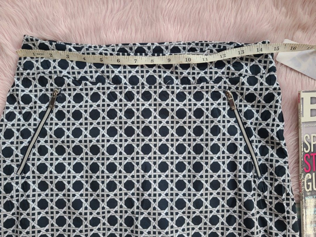 TAIL Women's Patterned Skirt with Zipper Pockets (Category: Skirts) located in Lingayen. Submitted by chloeswhite (Listing ID 1464265377, Image 3). Description: - Cute patterned skirt from TAIL - Navy and white geometric design - Zipper pockets on the front - Elasticated waistband - Great for casual wear or golf - Measurements shown in photos - Check photos for details -Waistline 30-31.