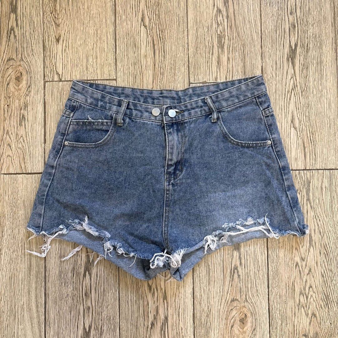 Tattered Denim Shorts (W:32) (Category: Shorts) located in Imus. Submitted by reloved.nd (Listing ID 1464249807, Image 1). Description: - Cute blue denim shorts - High-waisted style - Frayed hem - Two button closure at the front - Pockets on front and back - Ideal for casual wear - Easy to pair with any top.