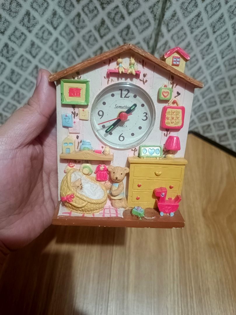 Teddy Bear Nursery Miniature House Clock (Category: Clocks) located in Makati City. Submitted by nyxhemera26 (Listing ID 1464322259, Image 2). Description: Teddy Bear Nursery Miniature House Clock Add a touch of nostalgic charm to your space with this adorable vintage house-shaped desk clock made of polyresin.Fully tested and working perfectly, this functional piece features a delightful 3D baby nursery scene complete with a tiny teddy bear, bass