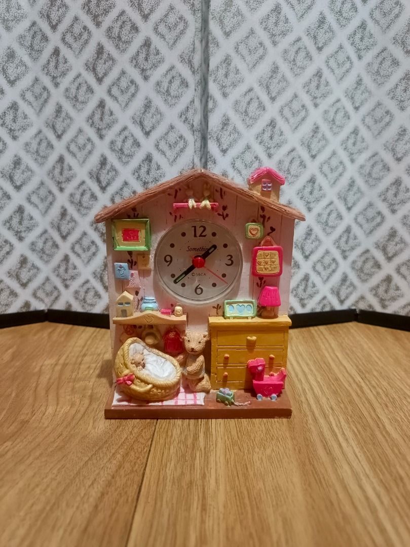 Teddy Bear Nursery Miniature House Clock (Category: Clocks) located in Makati City. Submitted by nyxhemera26 (Listing ID 1464322259, Image 1). Description: Teddy Bear Nursery Miniature House Clock Add a touch of nostalgic charm to your space with this adorable vintage house-shaped desk clock made of polyresin.Fully tested and working perfectly, this functional piece features a delightful 3D baby nursery scene complete with a tiny teddy bear, bass