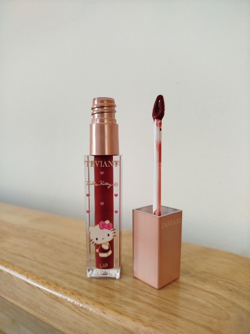 Teviant x Hello Kitty Lip Vinyl in Vacation (Category: Makeup) located in Quezon City. Submitted by luckycitrine (Listing ID 1464213286, Image 2). Description: - Used twice max, barely used - Brick red lip gloss, limited edition - RFS: warm undertone, not for me - Ships via Grab/Lalamove from Novaliches.