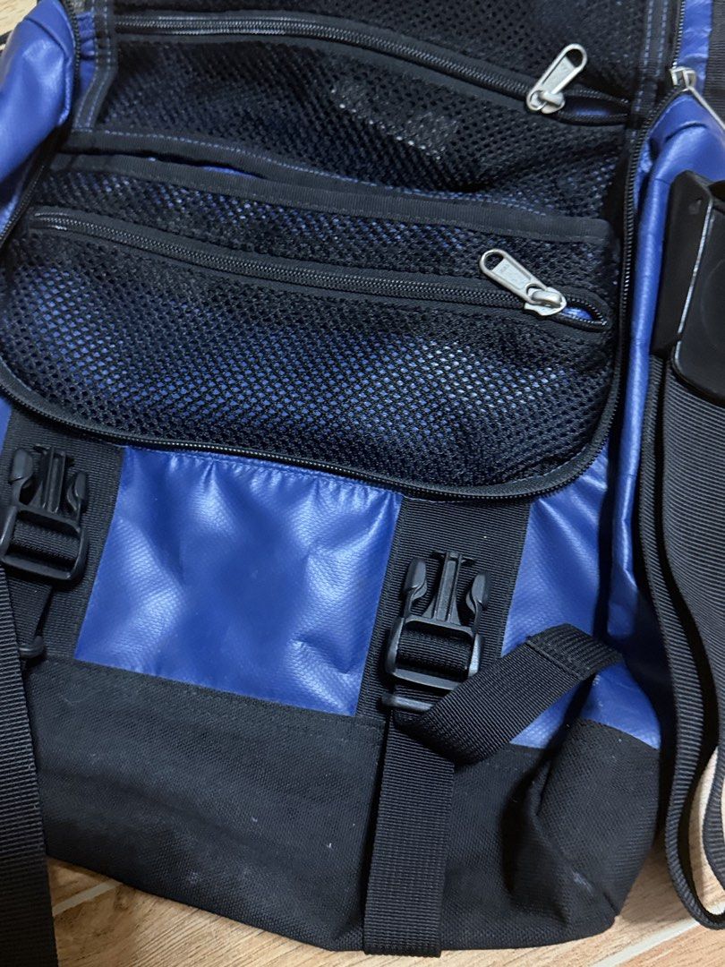 The North Face Blue Messenger Bag (Category: Sling Bags) located in Paranaque City. Submitted by nynrecto (Listing ID 1464150763, Image 2). Description: - Brand: The North Face - Color: Blue and Black - Type: Messenger Bag - Features: Multiple zippered pockets, internal mesh compartments - Strap: Adjustable for comfortable wear - Material: Durable - Ideal for: Everyday use, travel.