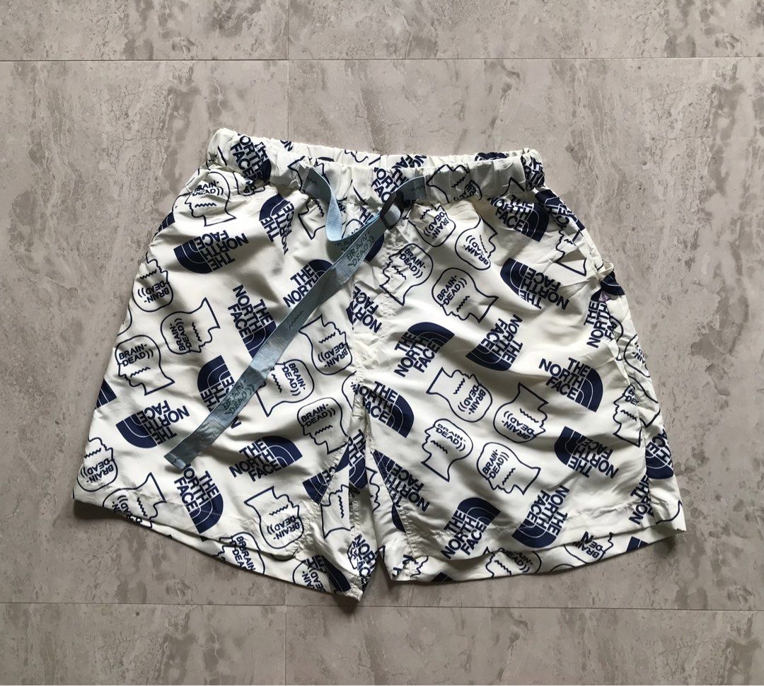 The North Face x Brain Dead Shorts Size M (Category: Shorts) located in Banga. Submitted by jorguarino (Listing ID 1464147731, Image 1). Description: - The North Face x Brain Dead collaboration shorts - Size: Medium (M) - All-over print featuring The North Face and Brain Dead logos - Elastic waistband with adjustable drawstring - Internal mesh lining for comfort - Made in China - Ideal for casual wear, streetwear, or athletic activities.