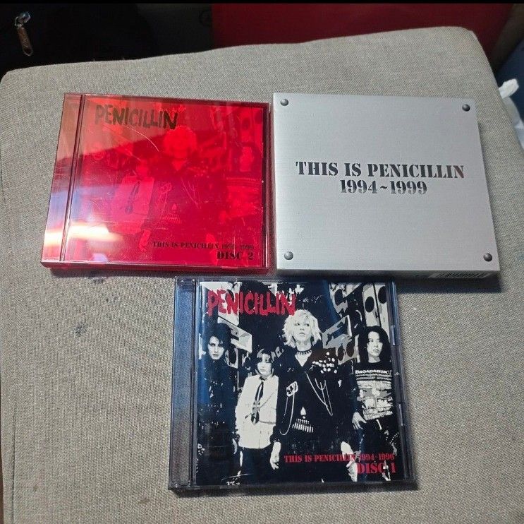 THIS IS PENICILLIN 1994-1999 CD Box Set (Category: CDs & DVDs) located in Quezon City. Submitted by dncpreloved (Listing ID 1464195041, Image 2). Description: - Penicillin 'This is Penicillin 1994-1999' CD Box Set - Includes Disc 1 and Disc 2 - Features a silver outer box with embossed title - Disc 2 comes in a red jewel case - Essential collection for Penicillin fans.