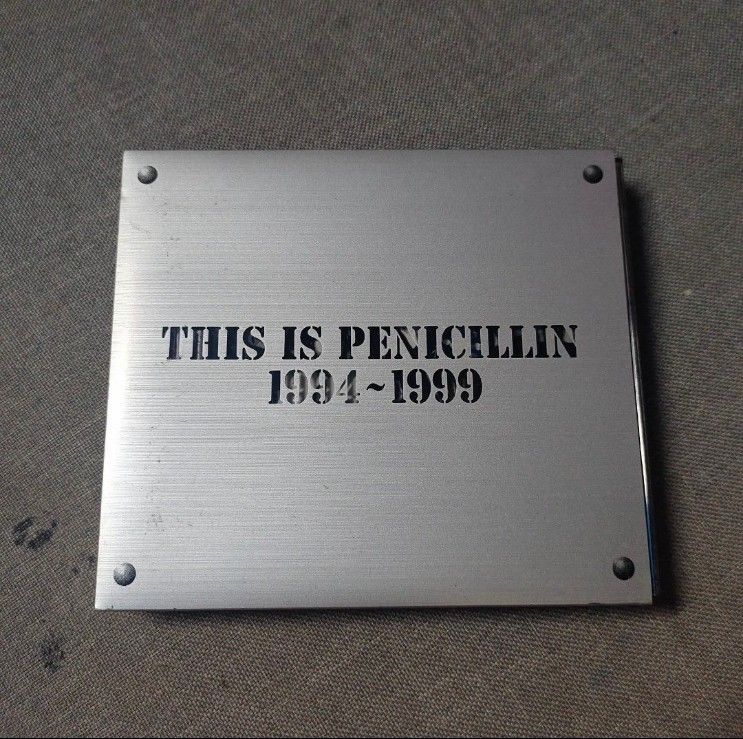 THIS IS PENICILLIN 1994-1999 CD Box Set (Category: CDs & DVDs) located in Quezon City. Submitted by dncpreloved (Listing ID 1464195041, Image 1). Description: - Penicillin 'This is Penicillin 1994-1999' CD Box Set - Includes Disc 1 and Disc 2 - Features a silver outer box with embossed title - Disc 2 comes in a red jewel case - Essential collection for Penicillin fans.