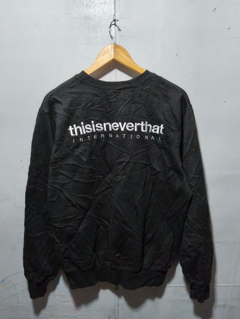 thisisneverthat International Crewneck Sweatshirt Black (Category: Coats, Jackets and Outerwear) located in Manila. Submitted by daledemata51026 (Listing ID 1464202161, Image 2). Description: - Brand: thisisneverthat - Color: Black - Style: Crewneck Sweatshirt - Features: Embroidered brand name on left chest - Back Graphic: Large 'thisisneverthat INTERNATIONAL' embroidery - Occasion: Casual wear - Comfort: Comfortable and stylish - Size: Small on