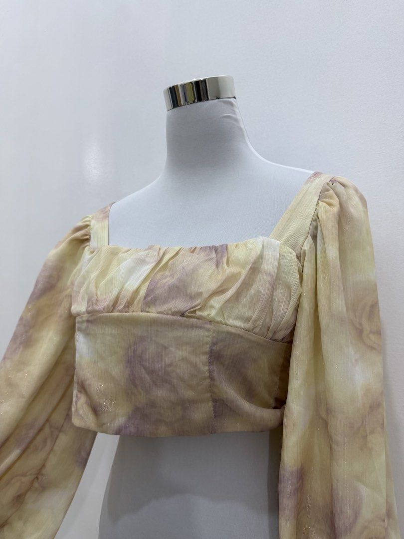 Tie-dye Square Neck Puff Sleeve Crop Top (Category: Shirts) located in Manila. Submitted by e.louise (Listing ID 1464334513, Image 2). Description: - Adorable tie-dye crop top - Features stylish puff sleeves - Flattering square neckline - Fabric has a subtle, elegant shimmer - Elasticated cuffs for a comfortable fit - Perfect for dressing up or down.
