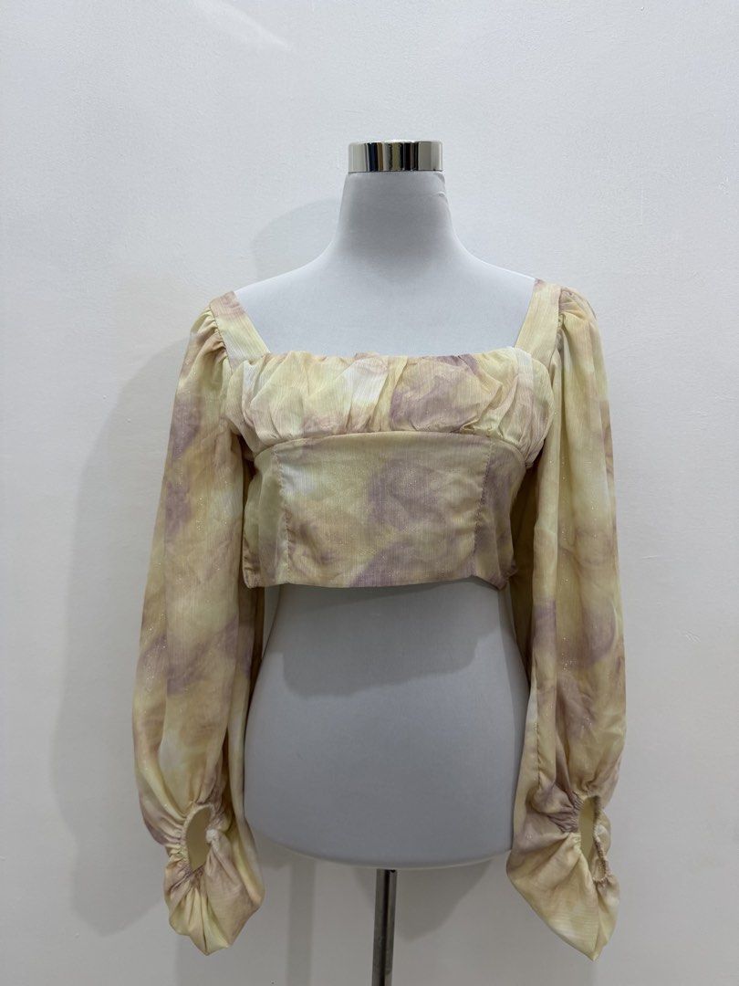 Tie-dye Square Neck Puff Sleeve Crop Top (Category: Shirts) located in Manila. Submitted by e.louise (Listing ID 1464334513, Image 1). Description: - Adorable tie-dye crop top - Features stylish puff sleeves - Flattering square neckline - Fabric has a subtle, elegant shimmer - Elasticated cuffs for a comfortable fit - Perfect for dressing up or down.