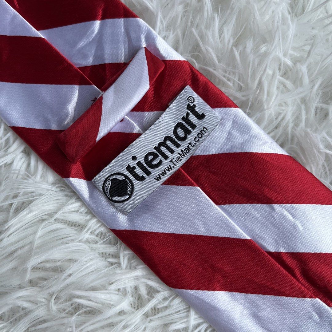 TieMart Red and White Striped Necktie (Category: Ties) located in Cuyapo. Submitted by Ashtyn.Pre.Loved (Listing ID 1464196121, Image 2). Description: - Classic red and white striped necktie - Brand: TieMart - Suitable for any occasion - Made with quality material - Simple and bold design - Excellent addition to your accessory collection.