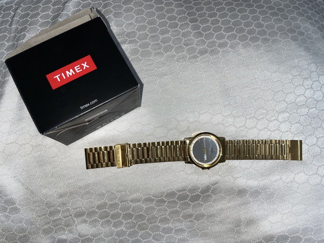Timex Gold Watch for Men (Category: Men's Watches) located in Quezon City. Submitted by yan.declutter (Listing ID 1464259046, Image 1). Description: - Original Timex - Gold stainless steel strap - White dial with Day-Date display - In good condition - Elegant & classy (pang-formal / pang-daily) - easy to adjust yung strap - used less than a month pa lang RFS: Change of mind; may nagustuhang iba .