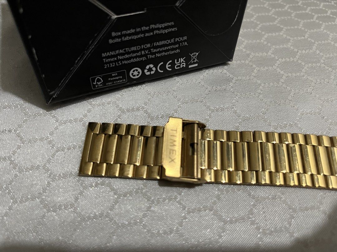 Timex Gold Watch for Men (Category: Men's Watches) located in Quezon City. Submitted by yan.declutter (Listing ID 1464259046, Image 3). Description: - Original Timex - Gold stainless steel strap - White dial with Day-Date display - In good condition - Elegant & classy (pang-formal / pang-daily) - easy to adjust yung strap - used less than a month pa lang RFS: Change of mind; may nagustuhang iba .