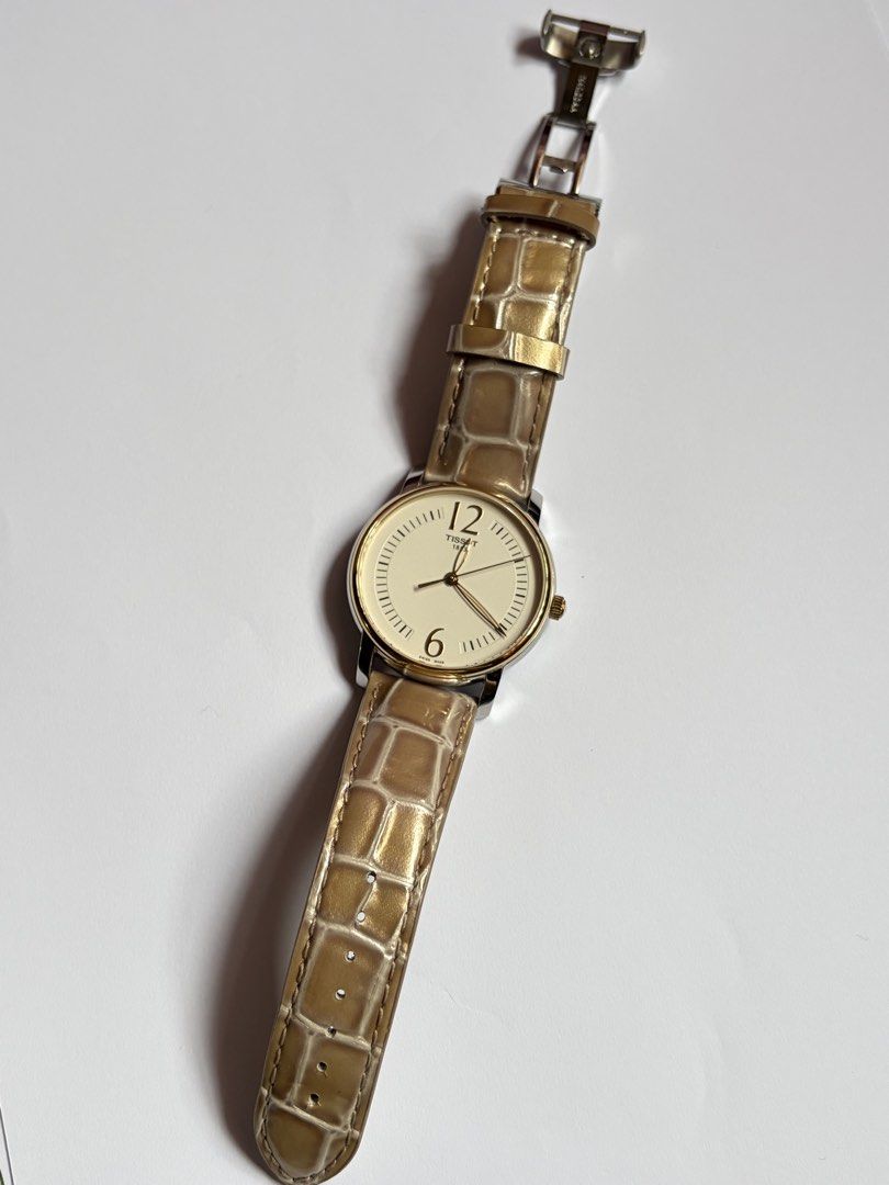 Tissot Lady Round (Category: Women's Watches) located in Pasig City. Submitted by moon.ef370a (Listing ID 1464162415, Image 3). Description: FOR SALE‼️ Tissot Lady Round 🤎 (Ref: T052.210.26.037.00) Highlights: • Premium Sapphire Crystal (Scratch-proof) • Swiss Quartz Movement • Complete Full Set (Original Box, Manual, & Warranty Card) • 38mm Yellow Gold-Plated Case with Brown Leather Strap 🤝 Meetups: Pasig City & nearby areas.