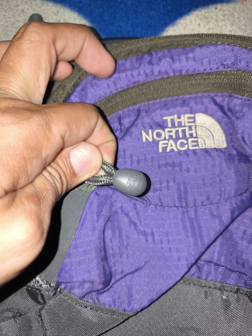 TNF Belt bag (Category: Belt bags, Clutches and Pouches) located in Manila. Submitted by fljaoti27 (Listing ID 1464253358, Image 2). Description: - The North Face waist bag - Stylish purple and grey colorway - Multiple zippered compartments for secure storage - Adjustable strap for a customized, comfortable fit - Ideal for travel or everyday essentials - Compact and easy to carry.