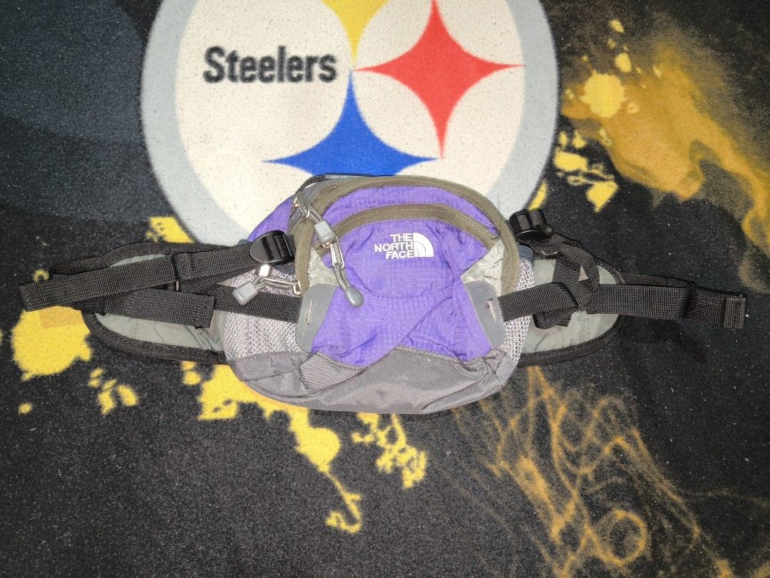 TNF Belt bag (Category: Belt bags, Clutches and Pouches) located in Manila. Submitted by fljaoti27 (Listing ID 1464253358, Image 1). Description: - The North Face waist bag - Stylish purple and grey colorway - Multiple zippered compartments for secure storage - Adjustable strap for a customized, comfortable fit - Ideal for travel or everyday essentials - Compact and easy to carry.
