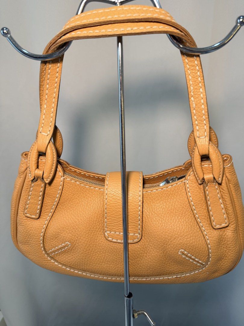 Tod’s authentic pebbled shoulder bag (Category: Luxury Bags & Wallets) located in Muntinlupa City. Submitted by atelier.archive (Listing ID 1464194208, Image 3). Description: - guaranteed authentic - money back if proven fake - can send more photos upon requests for sure buyers -no refunds/exchange - no bogus buyers - lowball offers will NOT be entertained .