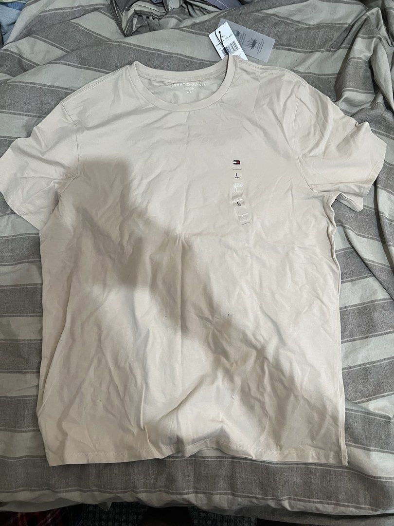 Tommy Hilfiger Crew neck T-Shirt (Category: Shirts) located in Paranaque City. Submitted by ekkostarfall.12902 (Listing ID 1464212621, Image 1). Description: - Brand New - Color: Beige - Size: Large - Quick dry - with tags MOP: Maya, Bank transfer SF shouldered by buyer Location: Parañaque.