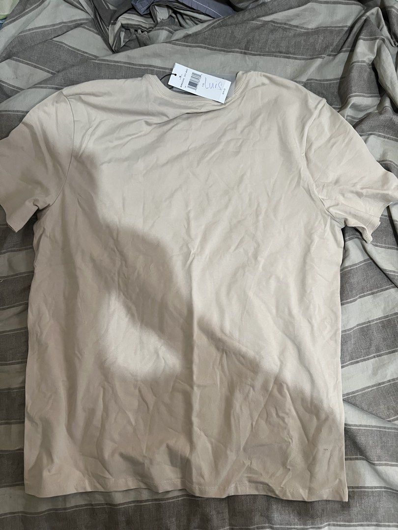 Tommy Hilfiger Crew neck T-Shirt (Category: Shirts) located in Paranaque City. Submitted by ekkostarfall.12902 (Listing ID 1464212621, Image 2). Description: - Brand New - Color: Beige - Size: Large - Quick dry - with tags MOP: Maya, Bank transfer SF shouldered by buyer Location: Parañaque.