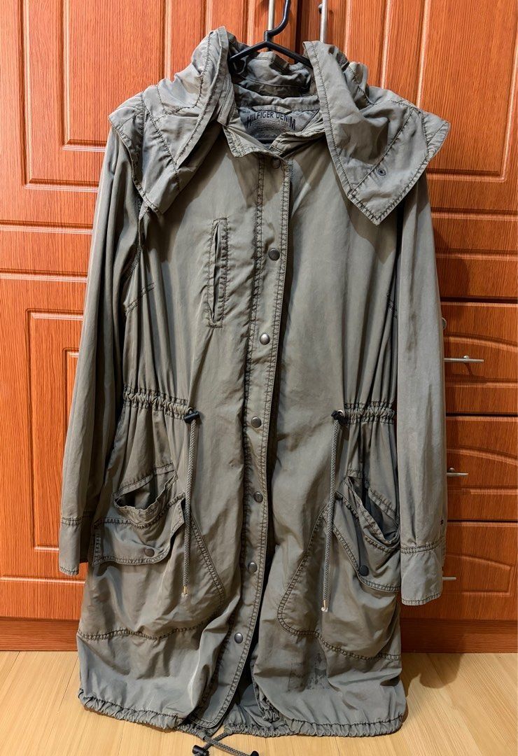 Tommy Hilfiger Parka Jacket with Hood Small - Large (Category: Coats, Jackets and Outerwear) located in Quezon City. Submitted by garagesale2026 (Listing ID 1464337557, Image 1). Description: - Preloved - In good condition - Runs big, S on tag, fits up to Large - Color: Olive - Length: Below knee for 5'4" tall - Removable hood; Drawstring at waist and hem; Button and zip closure; With cotton lining - Lightweight material.