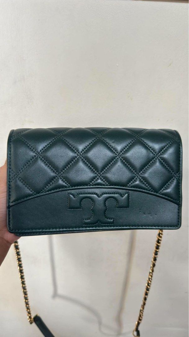 Tory Burch Green Quilted Leather Wallet on Chain (Category: Luxury Bags & Wallets) located in Manila. Submitted by chantalbe69523 (Listing ID 1464154436, Image 1). Description: - Authentic Green Tory Burch Wallet on Chain - Luxurious quilted leather with signature logo - Multiple interior card slots - Convenient zippered pocket - Elegant gold chain strap - Ideal for carrying your essentials in style.