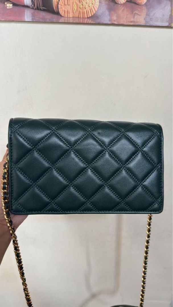 Tory Burch Green Quilted Leather Wallet on Chain (Category: Luxury Bags & Wallets) located in Manila. Submitted by chantalbe69523 (Listing ID 1464154436, Image 3). Description: - Authentic Green Tory Burch Wallet on Chain - Luxurious quilted leather with signature logo - Multiple interior card slots - Convenient zippered pocket - Elegant gold chain strap - Ideal for carrying your essentials in style.
