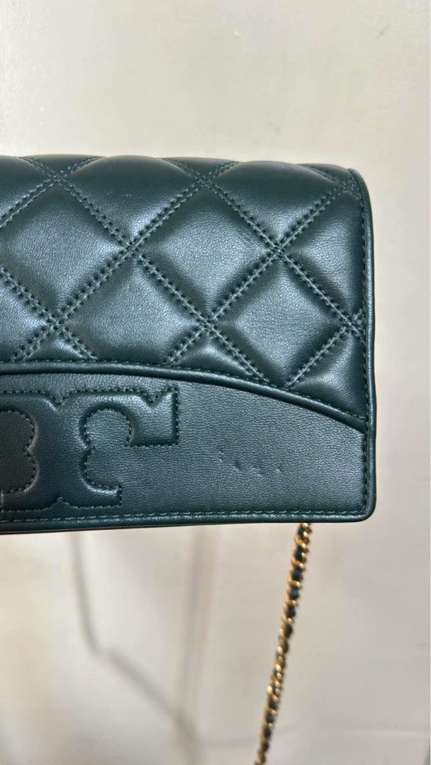 Tory Burch Green Quilted Leather Wallet on Chain (Category: Luxury Bags & Wallets) located in Manila. Submitted by chantalbe69523 (Listing ID 1464154436, Image 2). Description: - Authentic Green Tory Burch Wallet on Chain - Luxurious quilted leather with signature logo - Multiple interior card slots - Convenient zippered pocket - Elegant gold chain strap - Ideal for carrying your essentials in style.