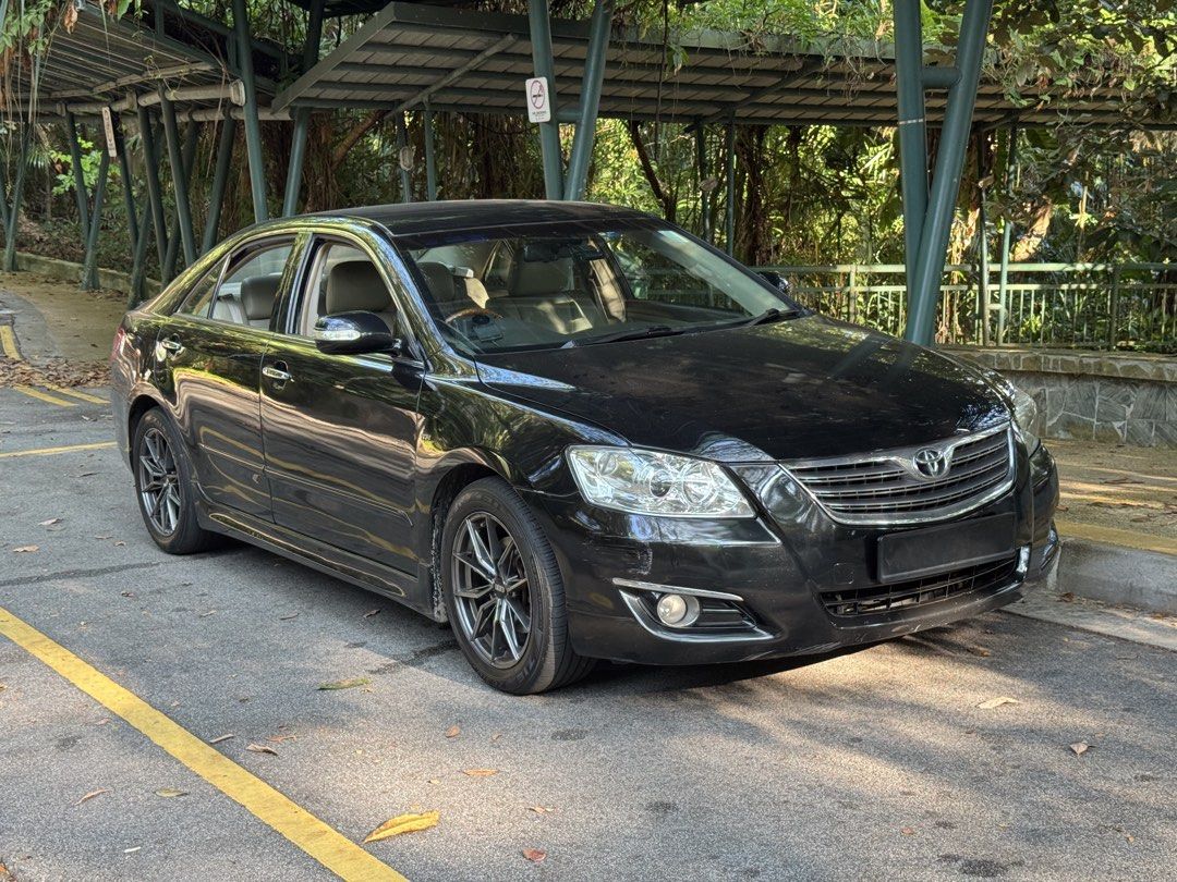 Toyota Camry 2.4 (A) (Category: Used Cars) located in Singapore. Submitted by quickphoenix_573035 (Listing ID 1464173442, Image 2). Description: The car is in excellent condition, jet black with striking BBS sports rims. Powerful and responsive. Gearbox and steering system were recently overhauled. High-powered sound system. Android dashboard screen managing audio, navigation, Google Maps and hands-free calls. Very low depreciation and running co