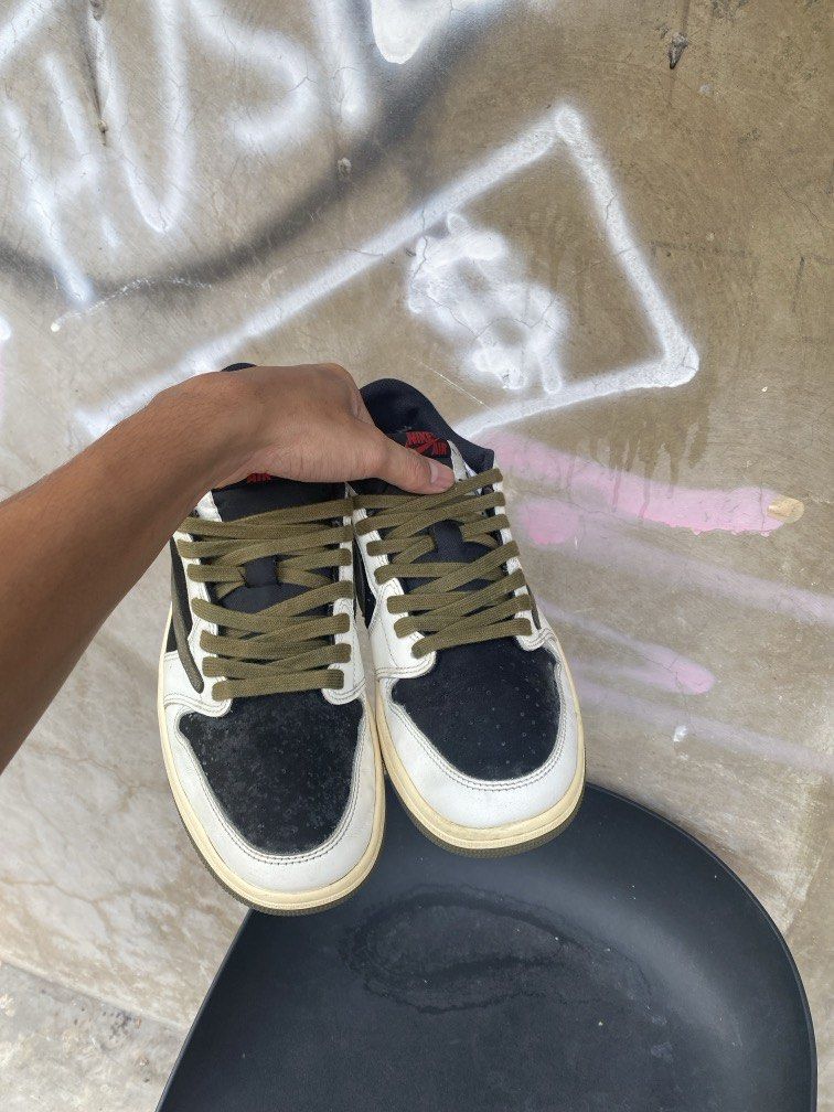 Travis Scott x Air Jordan 1 Low OG (Category: Sneakers) located in Manila. Submitted by w1seman (Listing ID 1464166112, Image 3). Description: - Travis Scott x Air Jordan 1 Low OG - Colorway: Black, White, Olive Green - Iconic Reverse Swoosh - Cactus Jack Branding on Heel - Olive Green Laces - Sail Colored Soles - Essential addition to any sneaker collection.