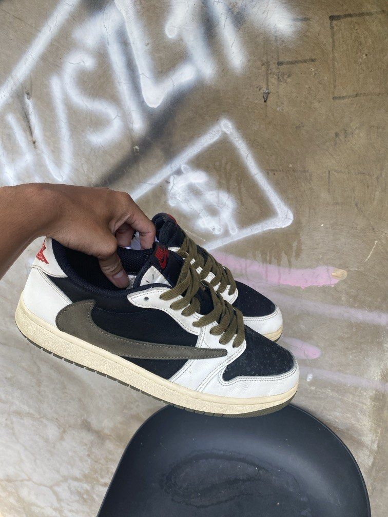 Travis Scott x Air Jordan 1 Low OG (Category: Sneakers) located in Manila. Submitted by w1seman (Listing ID 1464166112, Image 1). Description: - Travis Scott x Air Jordan 1 Low OG - Colorway: Black, White, Olive Green - Iconic Reverse Swoosh - Cactus Jack Branding on Heel - Olive Green Laces - Sail Colored Soles - Essential addition to any sneaker collection.