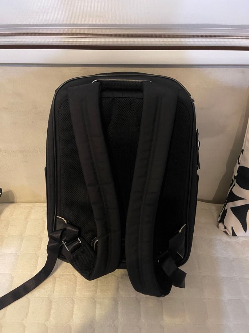TUMI Arrive Kingsford Backpack w/ Tags | Preloved (Category: Backpacks) located in Manila. Submitted by glgarcia31 (Listing ID 1464259170, Image 2). Description: Preloved TUMI Arrive Kingsford black backpack with tags shown in photos. Multiple zippered compartments and padded shoulder straps. Exterior is presentable, with visible signs of use on the straps and hardware. Interior pocket trim shows wear/fraying; please see the close-up photo. Sold 