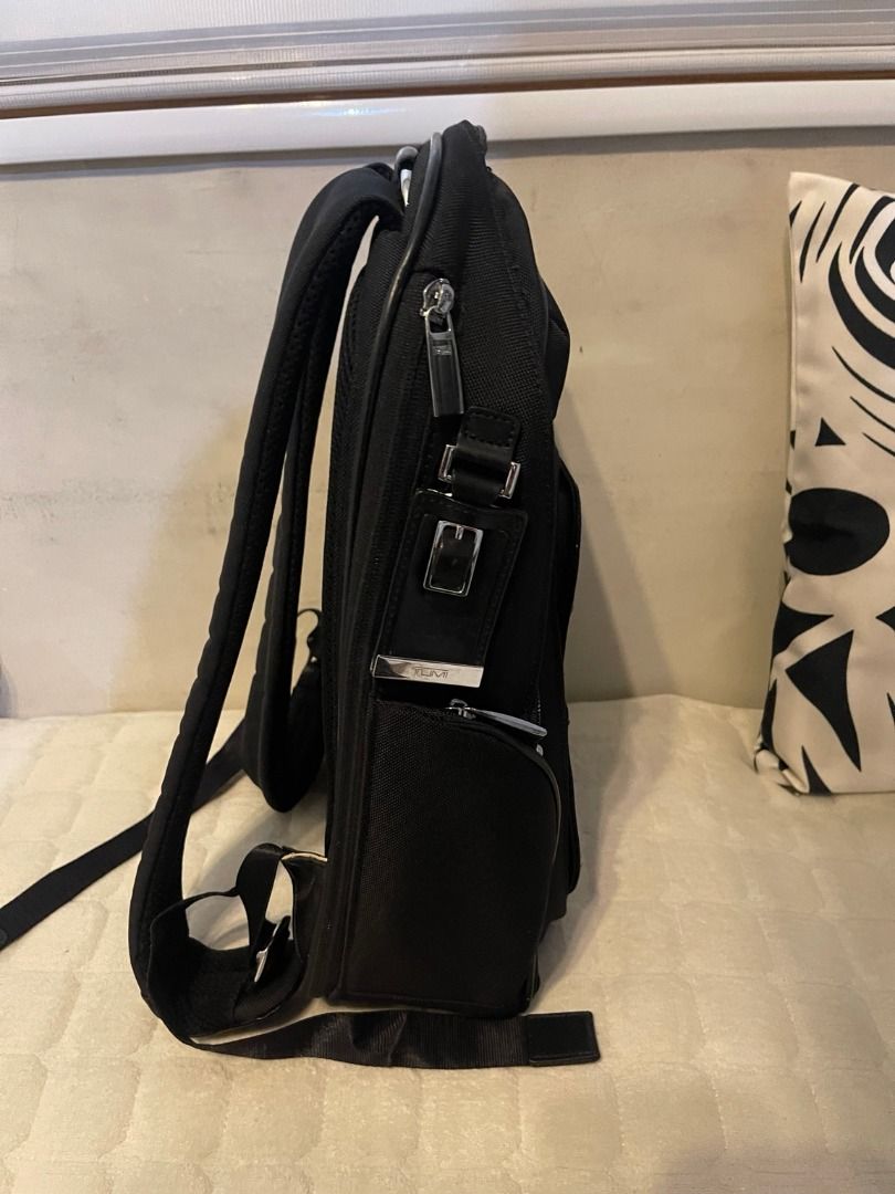 TUMI Arrive Kingsford Backpack w/ Tags | Preloved (Category: Backpacks) located in Manila. Submitted by glgarcia31 (Listing ID 1464259170, Image 3). Description: Preloved TUMI Arrive Kingsford black backpack with tags shown in photos. Multiple zippered compartments and padded shoulder straps. Exterior is presentable, with visible signs of use on the straps and hardware. Interior pocket trim shows wear/fraying; please see the close-up photo. Sold 