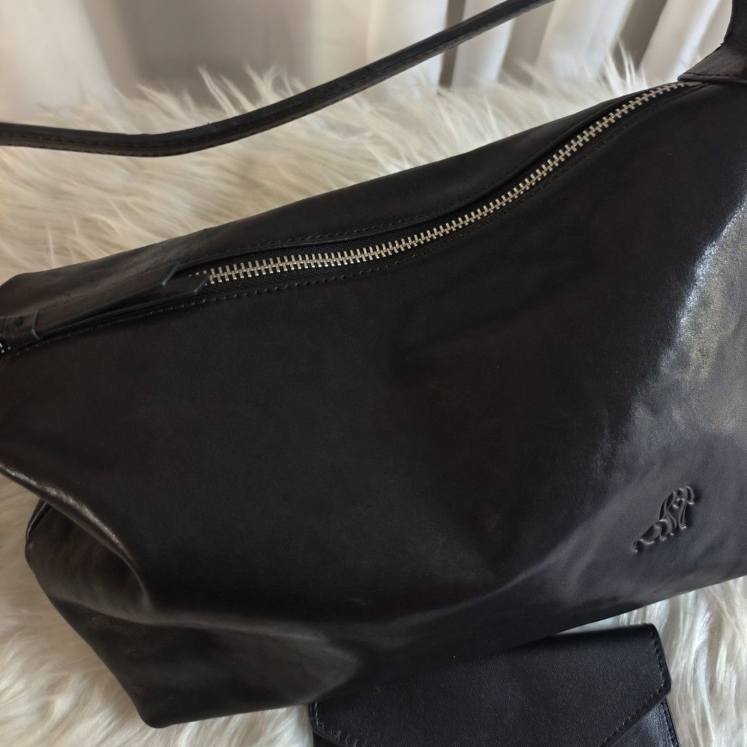 Two way bag with free wallet (Category: Cross-body Bags) located in General Santos City (Dadiangas). Submitted by zhia_preloved (Listing ID 1464236520, Image 3). Description: original, leather, minimal issue SA strap with free wallet same brand.
