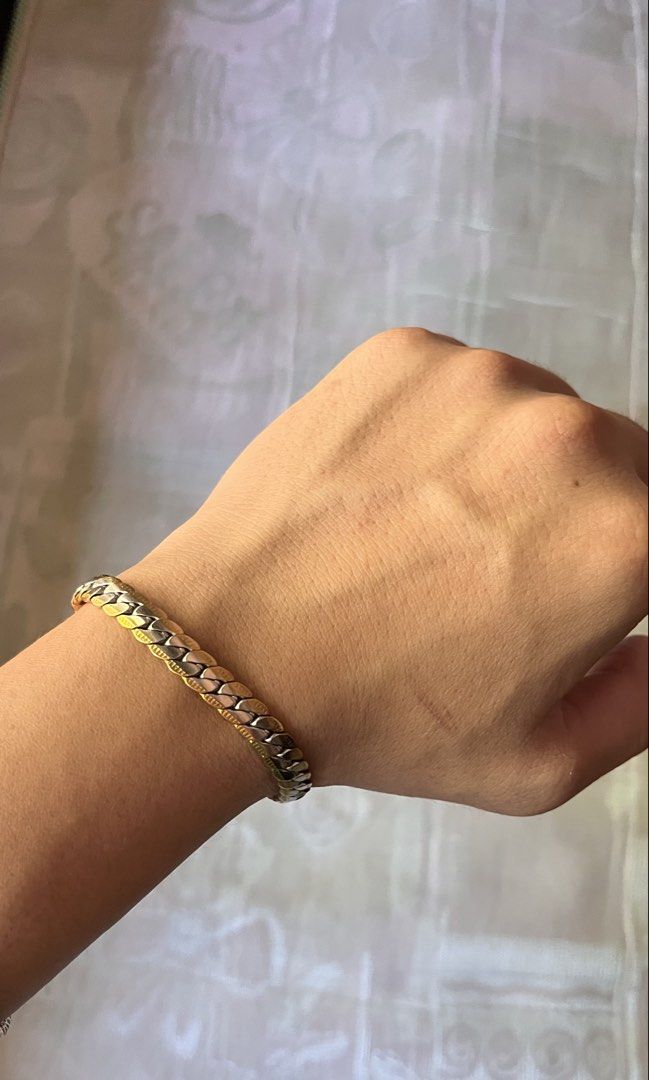 Two-Tone Herringbone Flat Link Bracelet (Category: Jewelry) located in Dinalupihan. Submitted by banditvaultco (Listing ID 1464176019, Image 3). Description: Condition: Excellent condition (no tarnish) • Design: Flat Herringbone / Chevron weave • Lock: Secure Lobster Clasp • Length: 7 inches • Material: Stainless Steel / Gold-Plated .