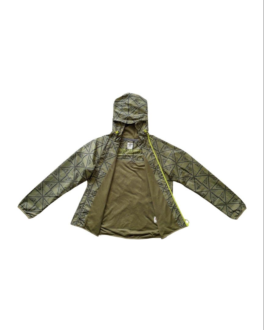 Umbro Packable Windbreaker (Category: Coats, Jackets and Outerwear) located in Manila. Submitted by morf_sply (Listing ID 1464304308, Image 2). Description: High collar with adjustable hood and visor made with weatherproof outer layer protection. Logo on the chest. Long sleeves with elasticated cuffs. Elasticated hem at the sides. Welt pockets. Medium on tag. Shoulder Width 18 in Pit to Pit 22 in Length 26 in Sleeves 25 in.