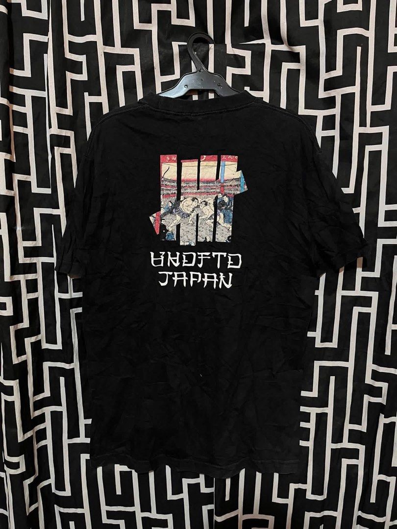 Undefeated Japan shirt (Category: Activewear) located in Manila. Submitted by bibiies2.0xghettothrift (Listing ID 1464141405, Image 2). Description: Undefeated Japan shirt Details W20 L28 Small to med ₱450 Loc.Baclaran Paranaque.