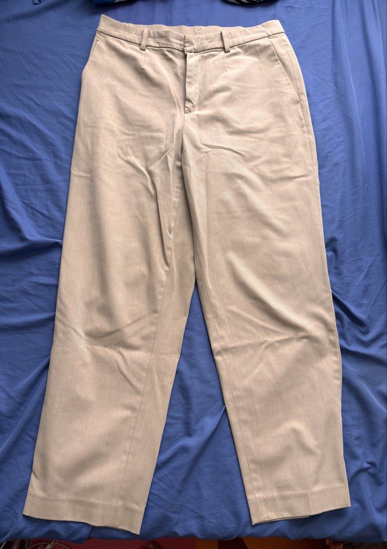 Uniqlo Brown Chino Pants (Category: Chinos) located in Pasig City. Submitted by bookishnook (Listing ID 1464245414, Image 1). Description: - Uniqlo Beige Chino Pants - Size: L - Waist: 69-75cm - Hip: 94-100cm - Material: 44% Polyester, 29% Rayon, 9% Spandex (Body); 100% Polyester (Pocket Lining) - Origin: Made in China - Ideal for: Casual wear.