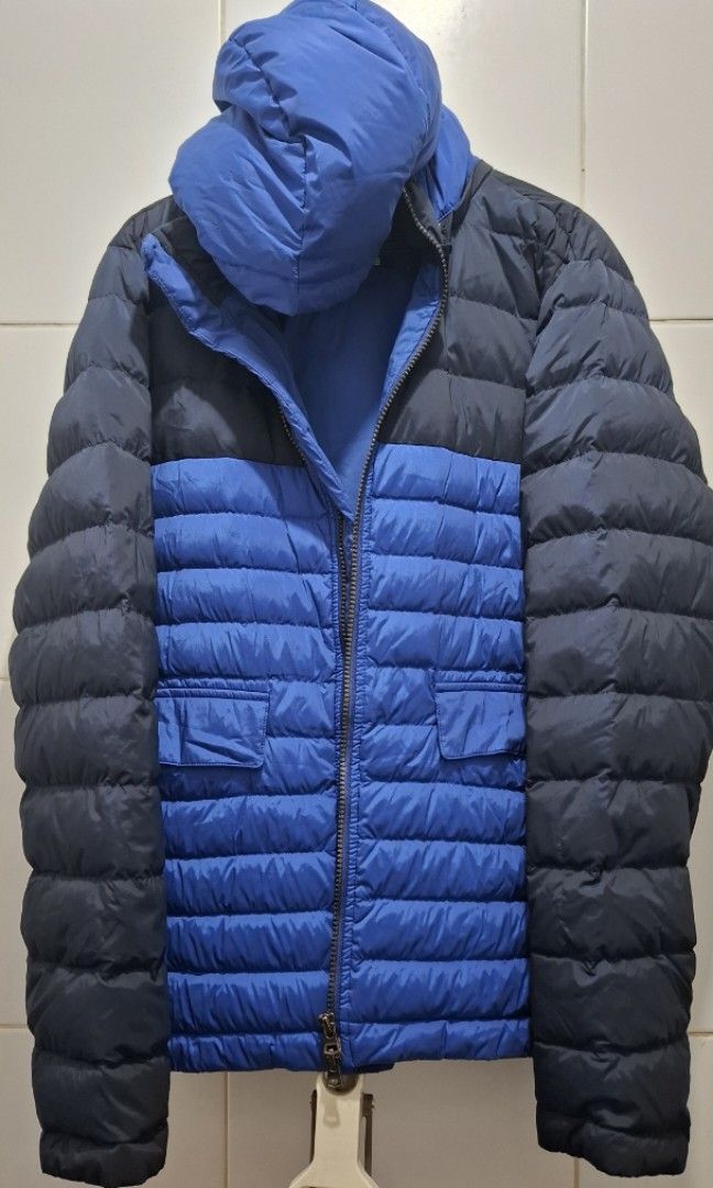 UNIQLO Jacket (Category: Coats, Jackets and Outerwear) located in Manila. Submitted by gentleclosetcollection (Listing ID 1464180739, Image 1). Description: Brand: Uniqlo x Theory (t.down by theory collboration) ​Size: Medium (M) ​Color: Two-Tone Blue & Dark Navy Block ​Material Shell: 90% Nylon, 10% Spandex (lightweight with subtle stretch) ​Insulation/Filling: Premium Down Blend (90% Down / 10% Feather) ​Features: Full-zip front closure, insula