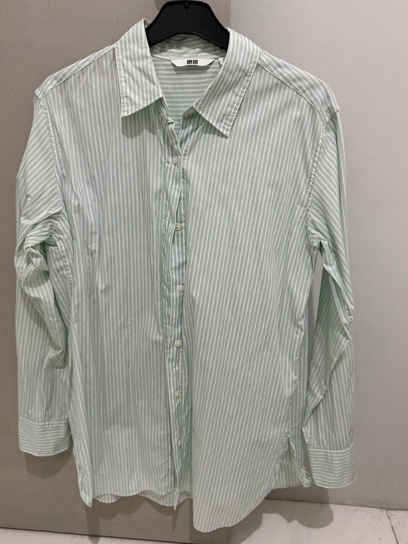 Uniqlo Striped Button-Up Shirt Size M (Category: Tshirts & Polo Shirts ) located in Mandaluyong City. Submitted by trovebya (Listing ID 1464236047, Image 1). Description: - Uniqlo Button-Up Shirt - Color: Light Green with White Pinstripes - Size: Medium (M) - Style: Long sleeves, collared - Versatile: Great for casual outfits or as a layering piece - Easy to style.
