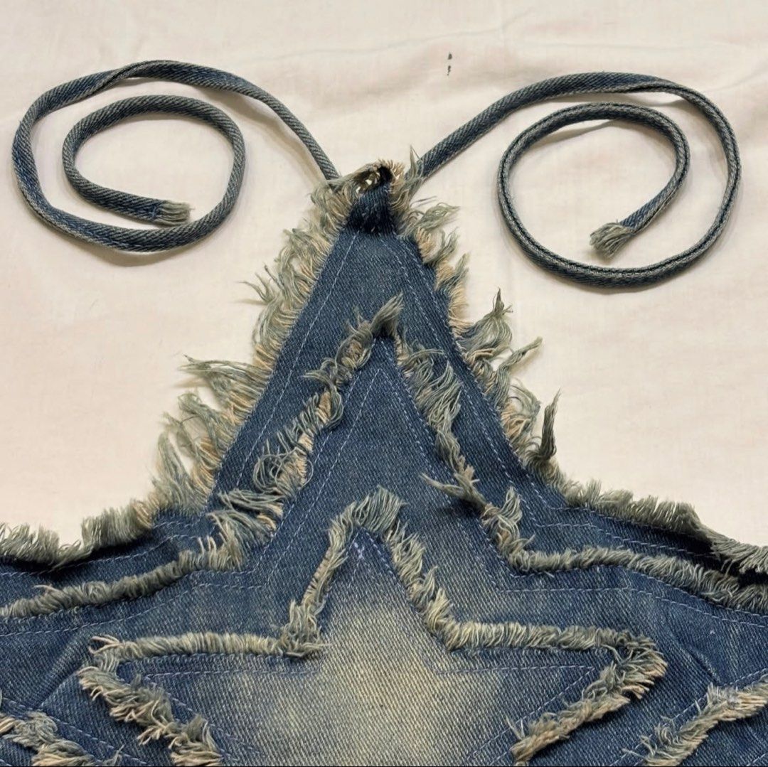 Unique Denim Star Halter Top with Fringed Edges (Category: Sleeveless) located in Caloocan City. Submitted by mmc1999 (Listing ID 1464294094, Image 2). Description: - Adorable star-shaped denim halter top - Features a distressed wash and frayed edges - Adjustable ties for a customized, comfortable fit - Perfect for festivals, parties, or a night out - Unique and eye-catching design.