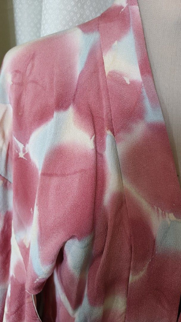 Unique Tie-Dye Kimono Jacket (Category: Coats, Jackets and Outerwear) located in Taguig. Submitted by ymicloset (Listing ID 1464212301, Image 2). Description: - Eye-catching tie-dye kimono jacket - Vibrant pink, white, and light blue abstract pattern - Open front design with wide sleeves - Estimated size: Medium to Large - Ideal for layering over tops or dresses - A truly unique fashion statement -Waist 36 in -Shoulder 24 in -Length 30 in Sleeve 