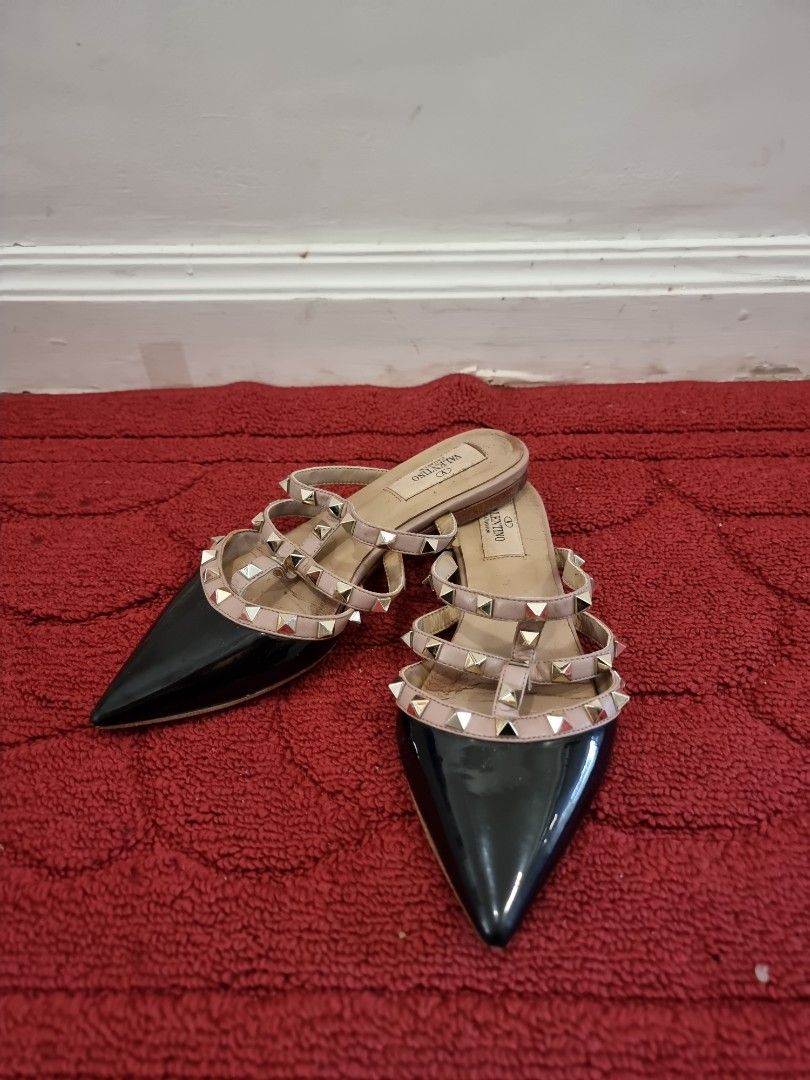 Valentino Rockstud Black Patent Leather Pointed Flats (Category: Flats & Sandals) located in Manila. Submitted by pickmemanila (Listing ID 1464146095, Image 1). Description: - Valentino Garavani Rockstud Flats - Color: Black patent leather with nude straps - Hardware: Gold studs - Design: Pointed toe - Versatile: Ideal for dressing up or down.