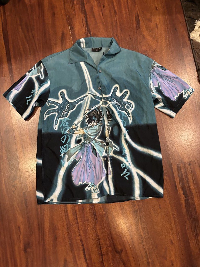 Vintage Anime Button Up Shirt (Category: Tshirts & Polo Shirts ) located in Quezon City. Submitted by closetskey (Listing ID 1464246284, Image 1). Description: - Unique anime button-up shirt - Short sleeves and collared design - Large sizing, good for oversized look.