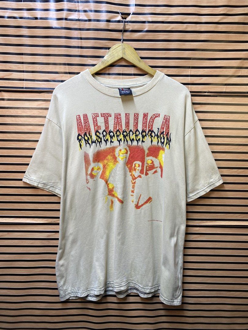 vintage beige Metallica "False Perception" graphic tee (Category: Tshirts & Polo Shirts ) located in Makati City. Submitted by drip.poww (Listing ID 1464229929, Image 1). Description: - Authentic Metallica Ny Giant - Color: Beige - Size: XL - Dimes: 24x28 - Authentic - Excellent condition - Need wash, fresh from bale - Material: 100% Cotton Please don’t expect too much—these are thrifted (ukay) items. 😊 !!STILL NEGOTIABLE!!.