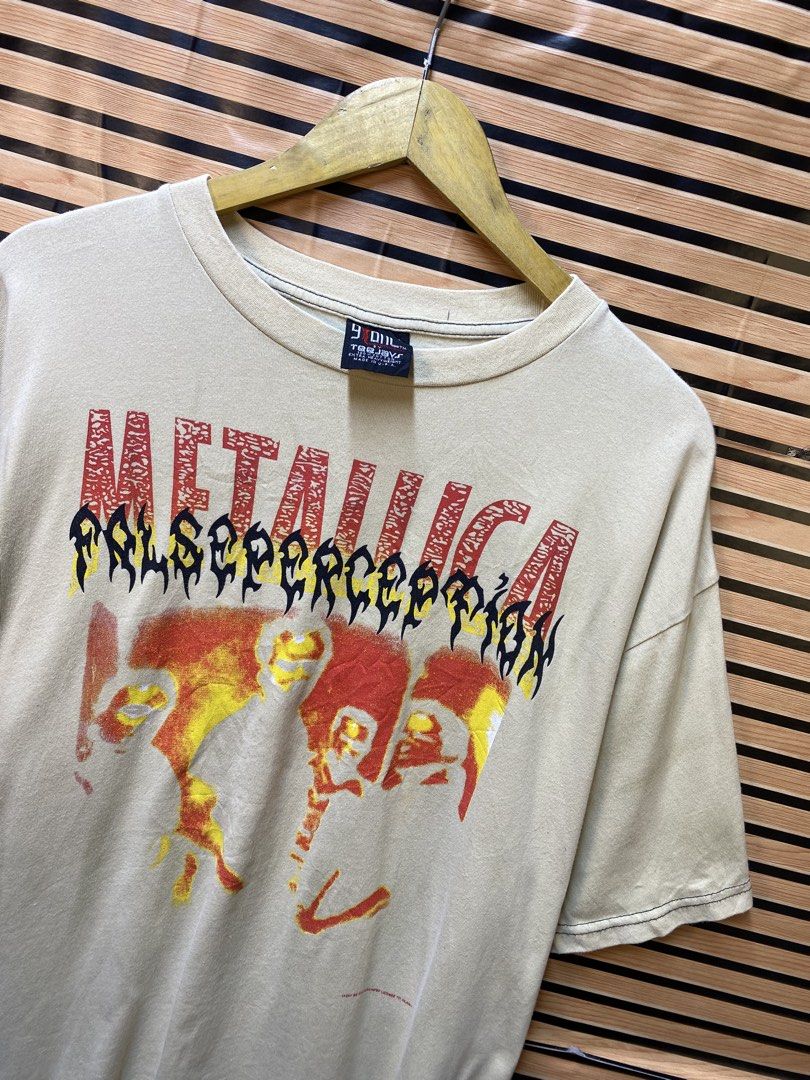 vintage beige Metallica "False Perception" graphic tee (Category: Tshirts & Polo Shirts ) located in Makati City. Submitted by drip.poww (Listing ID 1464229929, Image 3). Description: - Authentic Metallica Ny Giant - Color: Beige - Size: XL - Dimes: 24x28 - Authentic - Excellent condition - Need wash, fresh from bale - Material: 100% Cotton Please don’t expect too much—these are thrifted (ukay) items. 😊 !!STILL NEGOTIABLE!!.