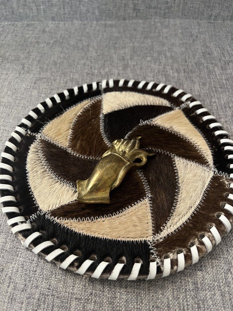 Vintage Brass Squid Figurine on Patchwork Coaster (Category: Vintage Collectibles) located in Las Pinas. Submitted by maple0305 (Listing ID 1464180056, Image 1). Description: - Unique brass squid figurine - Attached to a round coaster made of stitched animal hide patches - Coaster features a black and white striped edge - Great conversation piece for desk or shelf - Measures approximately 6 inches in diameter - Brass has a nice, aged patina - Qui