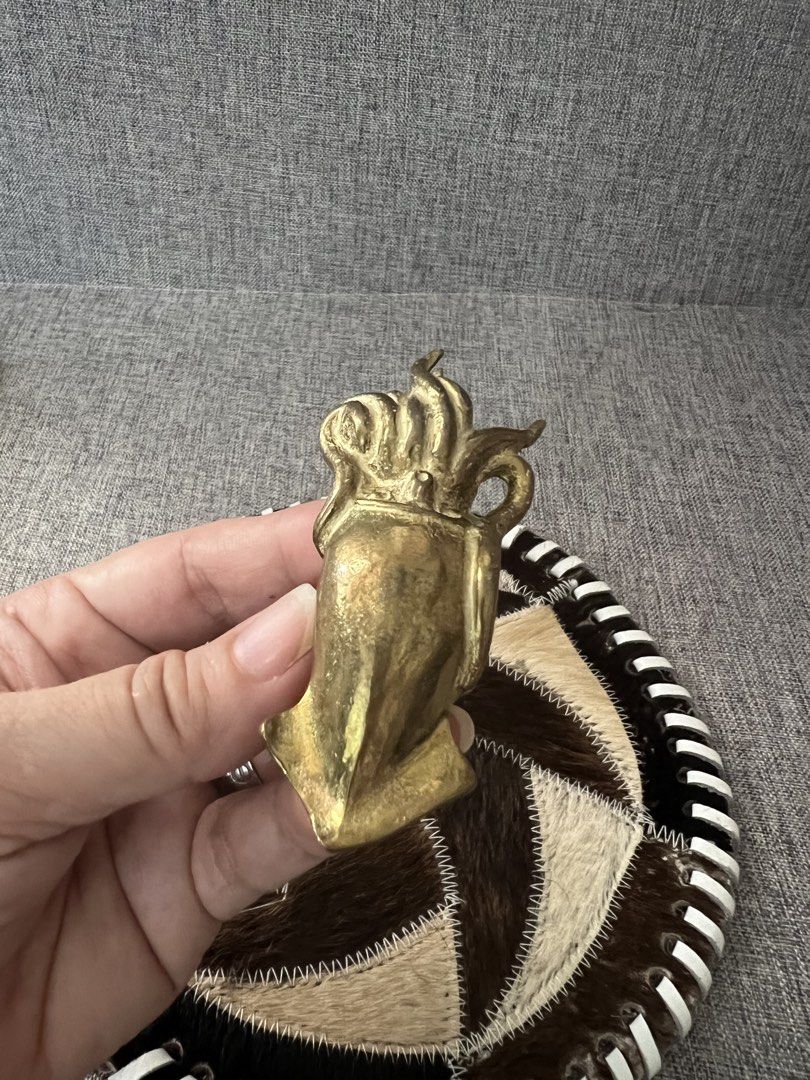 Vintage Brass Squid Figurine on Patchwork Coaster (Category: Vintage Collectibles) located in Las Pinas. Submitted by maple0305 (Listing ID 1464180056, Image 2). Description: - Unique brass squid figurine - Attached to a round coaster made of stitched animal hide patches - Coaster features a black and white striped edge - Great conversation piece for desk or shelf - Measures approximately 6 inches in diameter - Brass has a nice, aged patina - Qui